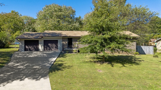 view of front facade featuring a garage and a front lawn