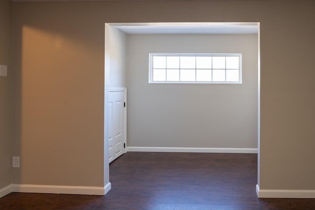 empty room with dark hardwood / wood-style floors