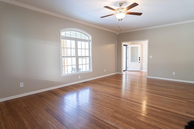 unfurnished room with ceiling fan, crown molding, and wood-type flooring