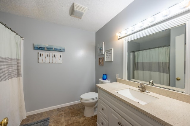 115 Lake Cir, Harriman, TN 37748 - full bath featuring stone finish floors, toilet, vanity, baseboards, and a textured ceiling
