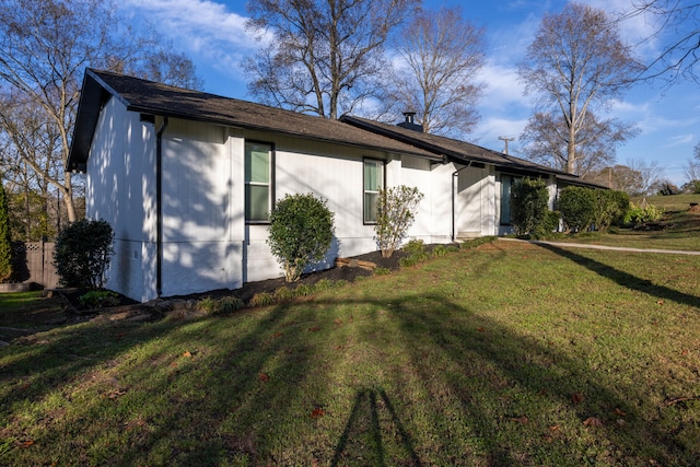 view of property exterior with a yard