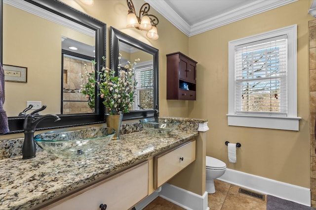 bathroom featuring vanity, tile patterned flooring, ornamental molding, and toilet