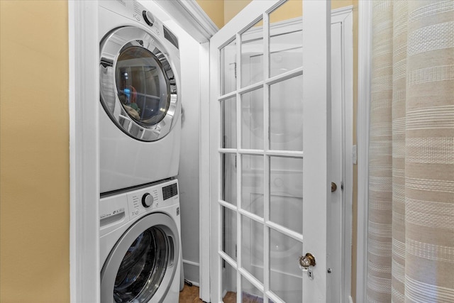 washroom with stacked washer and clothes dryer