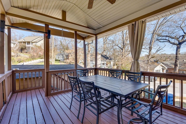 wooden deck featuring ceiling fan