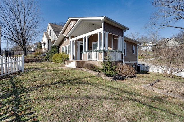 view of property exterior with a porch and a lawn