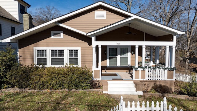 bungalow-style home featuring a porch and ceiling fan