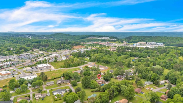 drone / aerial view featuring a view of trees