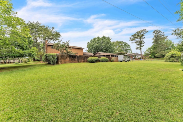 view of yard featuring fence