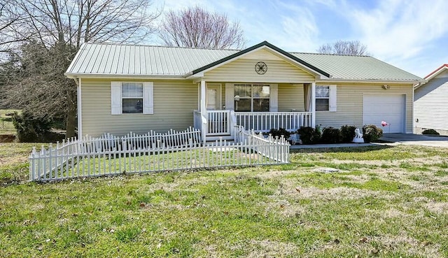 view of front of home with an attached garage, fence, covered porch, and metal roof