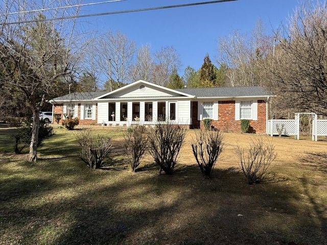 view of front of home featuring brick siding