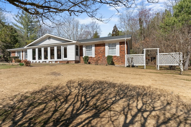 view of front of property featuring brick siding