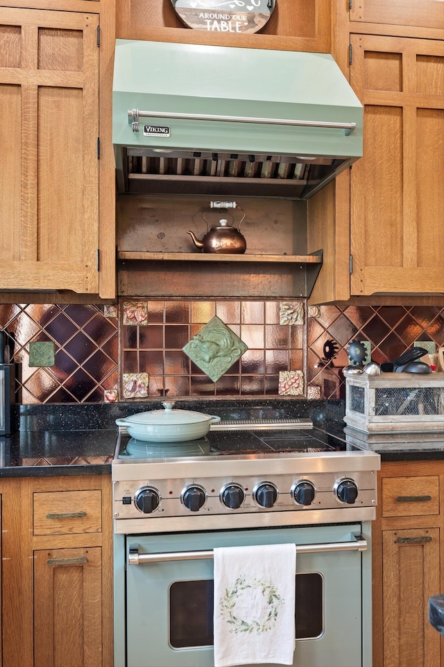 212 N Palisades Dr, Signal Mountain, TN 37377 - kitchen featuring high end range, extractor fan, tasteful backsplash, and dark countertops