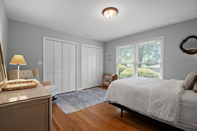 212 N Palisades Dr, Signal Mountain, TN 37377 - bedroom with multiple closets and wood finished floors