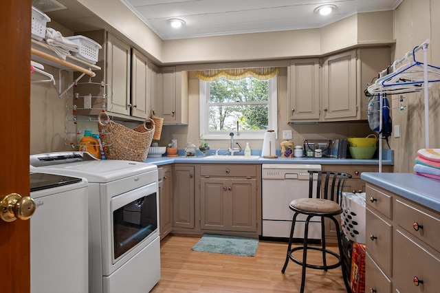 212 N Palisades Dr, Signal Mountain, TN 37377 - laundry room with washer and clothes dryer, light wood finished floors, and ornamental molding