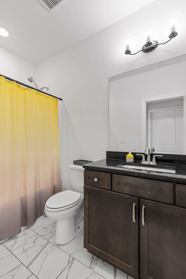 full bathroom featuring shower / bath combo, toilet, and vanity