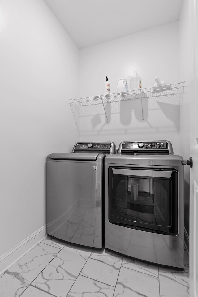 laundry room with separate washer and dryer