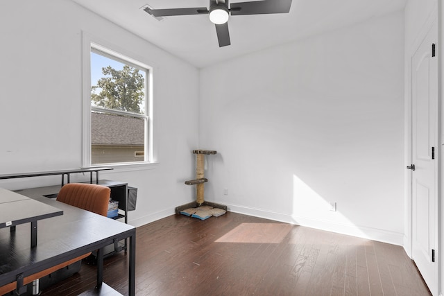 office with ceiling fan and dark wood-type flooring