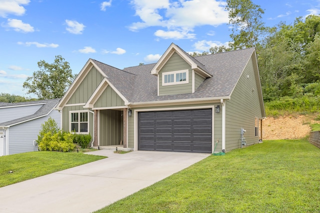 view of front facade with a front yard and a garage