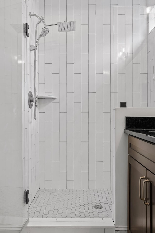 bathroom with vanity and walk in shower