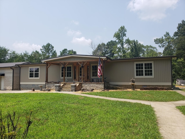 view of front of home with a porch and a front lawn