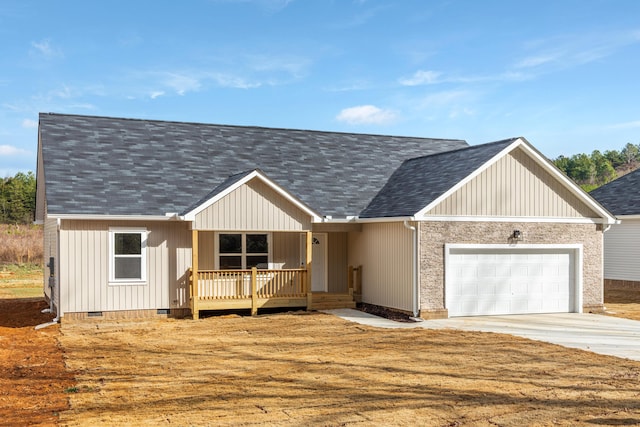 view of front facade with covered porch and a garage