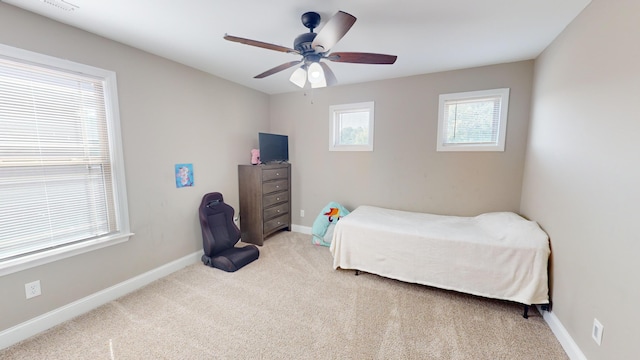 carpeted bedroom featuring ceiling fan