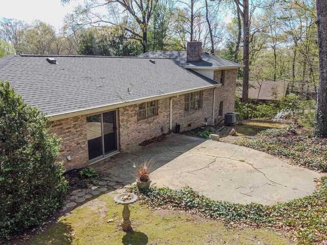 624 Pinecrest Dr, Athens, TN 37303 - rear view of house featuring a patio area, central AC unit, a chimney, and a shingled roof