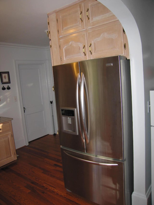 kitchen featuring crown molding, stainless steel fridge, light brown cabinets, and dark wood-type flooring