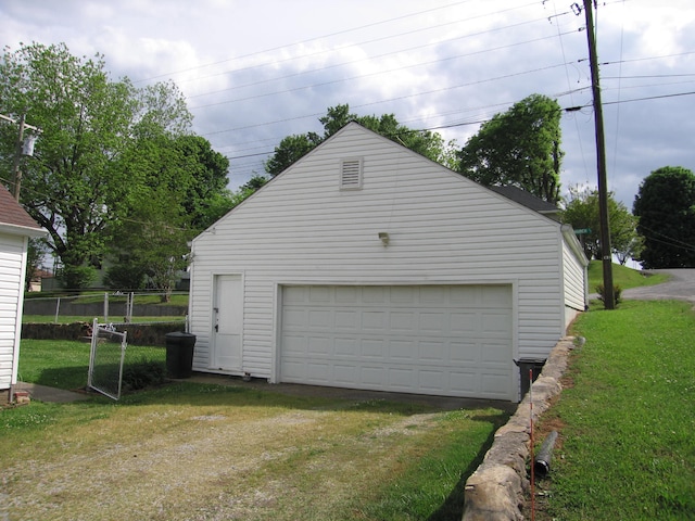 garage with a yard