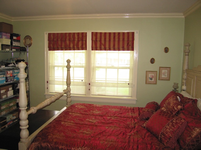 bedroom featuring crown molding