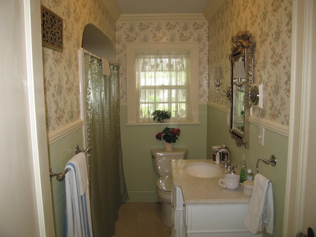 bathroom featuring crown molding, tile patterned flooring, vanity, and toilet