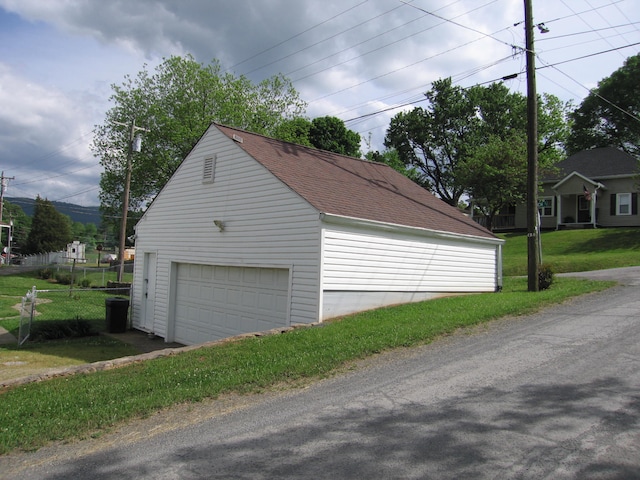 garage featuring a yard