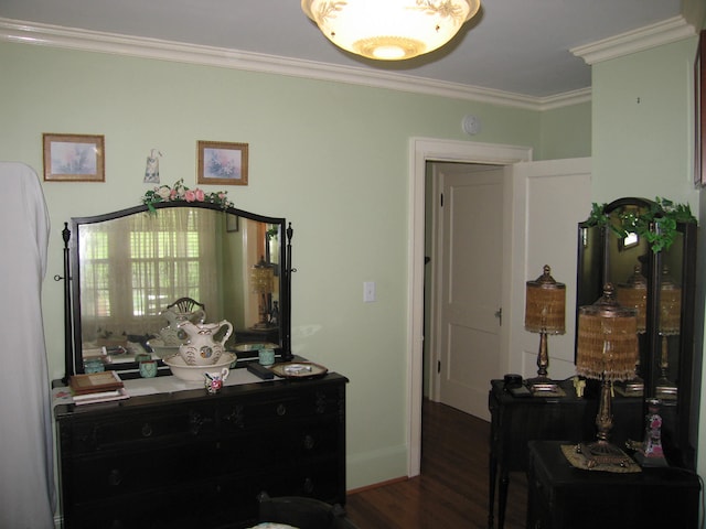 bedroom featuring dark hardwood / wood-style flooring and ornamental molding