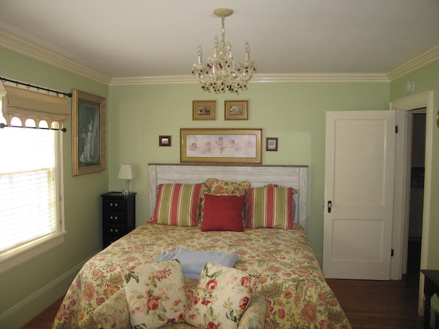 bedroom with dark hardwood / wood-style flooring, ornamental molding, and a chandelier