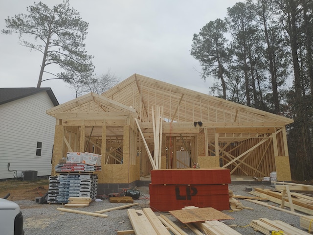 exterior space featuring an outbuilding and central AC