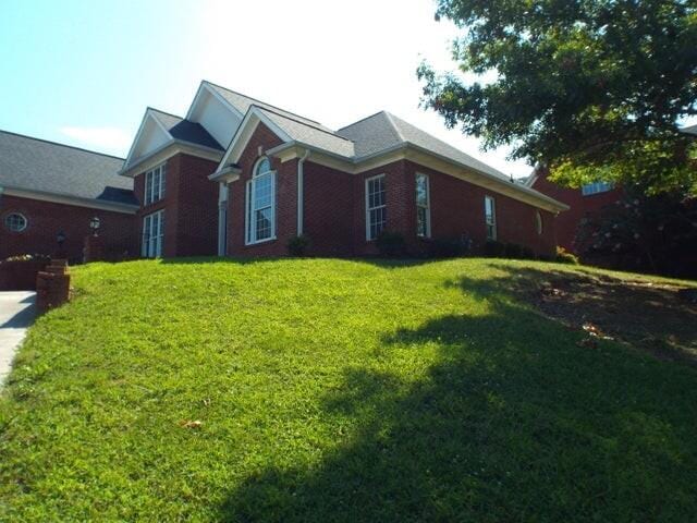 1951 Weston Hills Dr NW, Cleveland, TN 37312 - view of side of property with brick siding and a yard