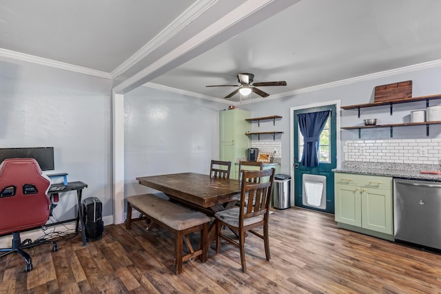 dining space with wood finished floors, crown molding, and a ceiling fan