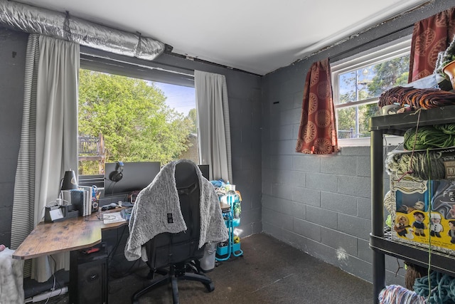 home office with concrete block wall