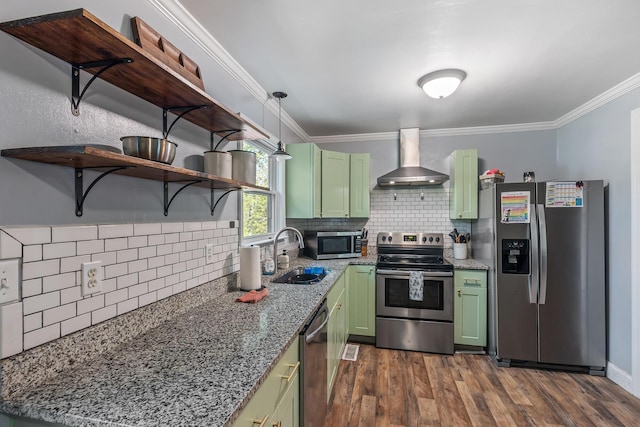 kitchen with a sink, green cabinets, stainless steel appliances, wall chimney exhaust hood, and dark wood-type flooring