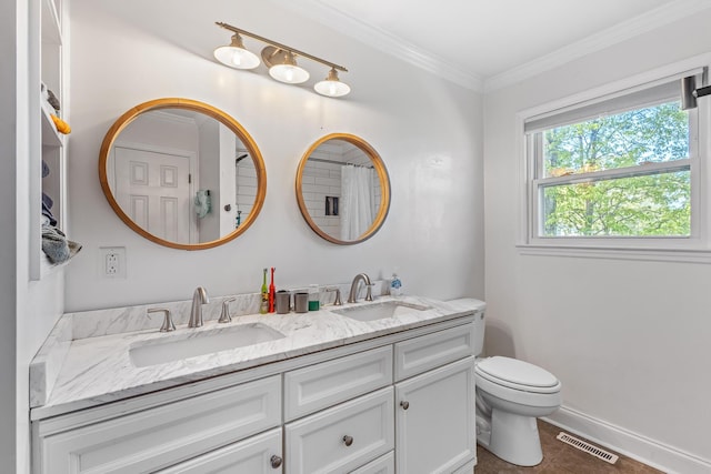 bathroom featuring visible vents, a sink, double vanity, and toilet