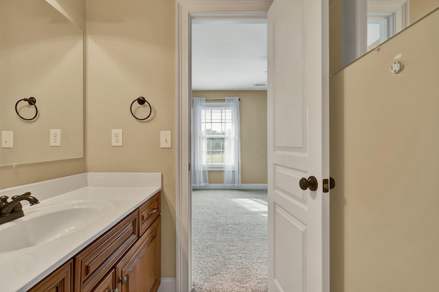 bathroom with vanity and baseboards