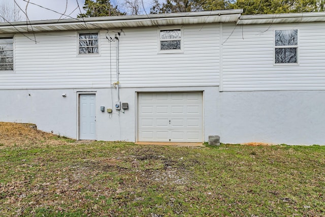 garage with a lawn