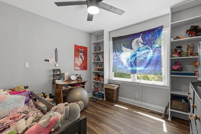 bedroom with ceiling fan and dark wood-type flooring