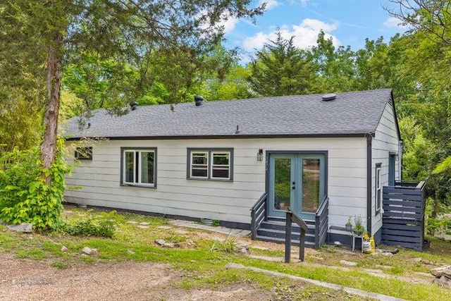 rear view of property with french doors