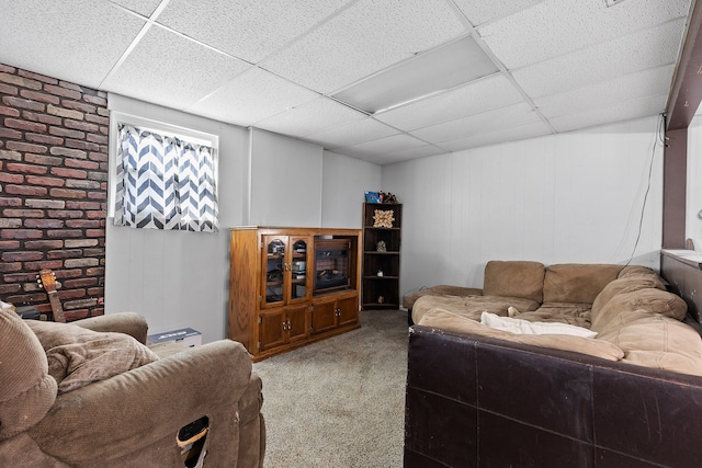 carpeted living room featuring a paneled ceiling