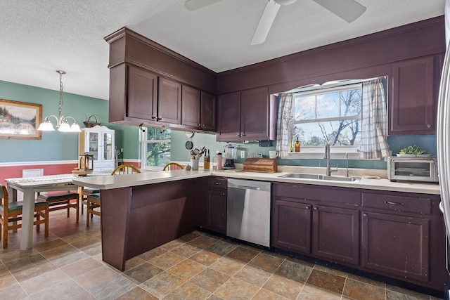 kitchen with dishwasher, a healthy amount of sunlight, decorative light fixtures, and sink