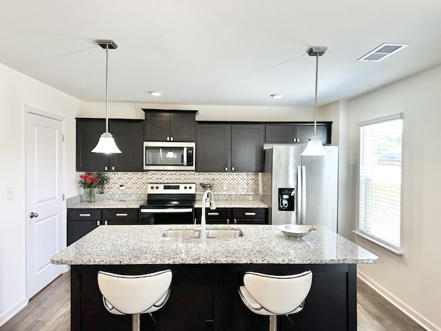 119 Lindsell Rd, Athens, TN 37303 - kitchen with stainless steel appliances, a sink, tasteful backsplash, baseboards, and wood finished floors