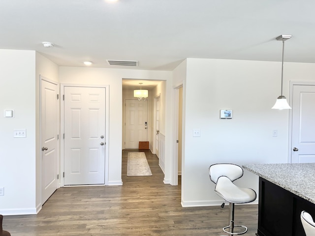 119 Lindsell Rd, Athens, TN 37303 - interior space with baseboards, light stone countertops, wood finished floors, and visible vents