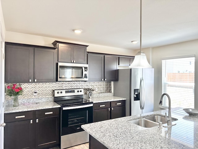 119 Lindsell Rd, Athens, TN 37303 - kitchen with light stone counters, decorative backsplash, appliances with stainless steel finishes, and a sink