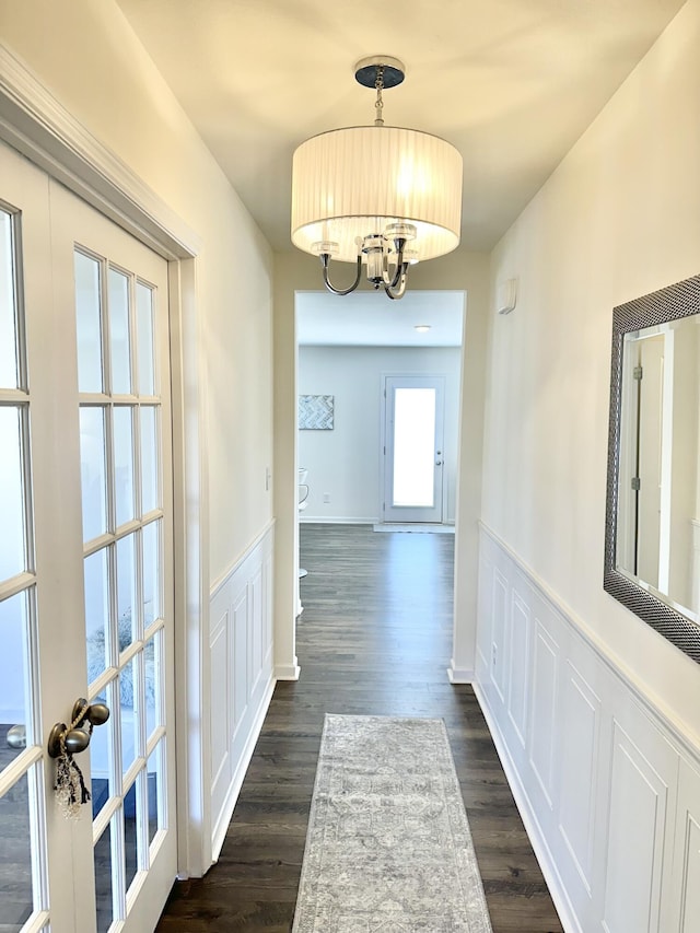 119 Lindsell Rd, Athens, TN 37303 - hall featuring dark wood-style flooring, a notable chandelier, and a wainscoted wall